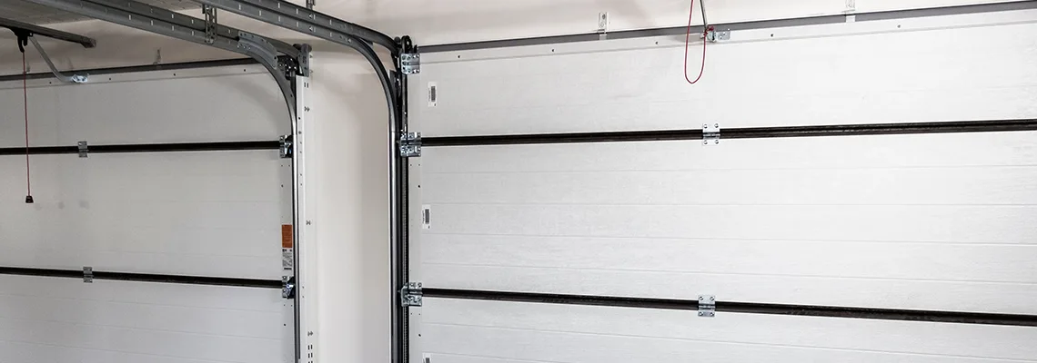 Fix Folding Garage Door Jerking in Delray Beach